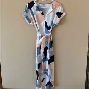 Patterned dress with belt.